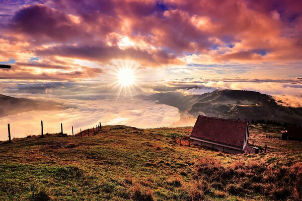 A house in the mountains in Switzerland under the sun