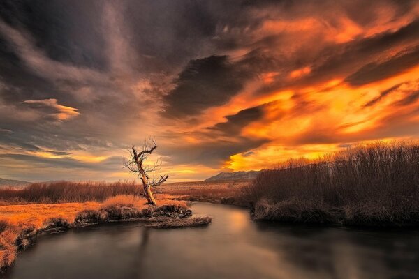 Gloomy sunset sky over the river