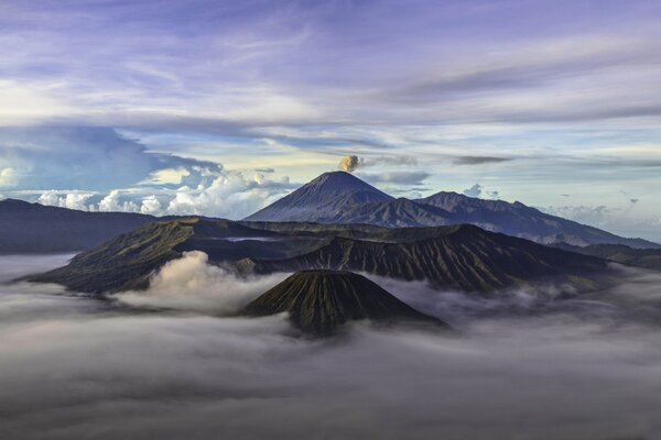 Above the clouds is a sleeping volcano from the height of a bird s flight