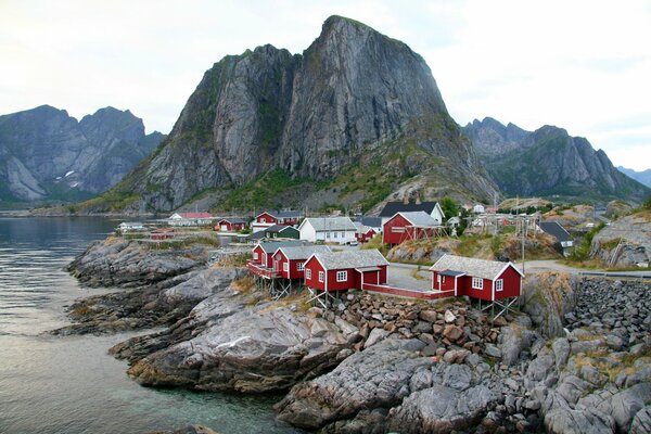 Bright red houses on the shore of the Norwegian Gulf