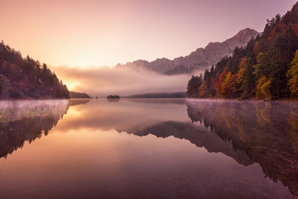 Autumn walk on the river in the fog