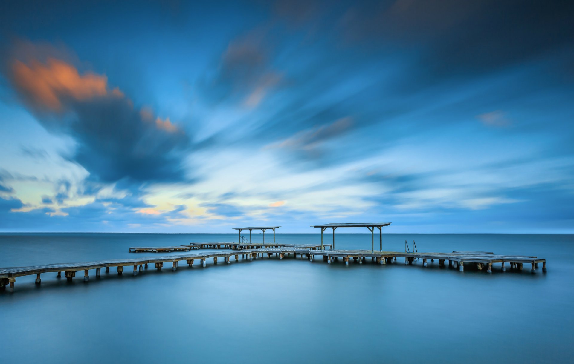 españa mar calma puente muelle costa tarde cielo nubes