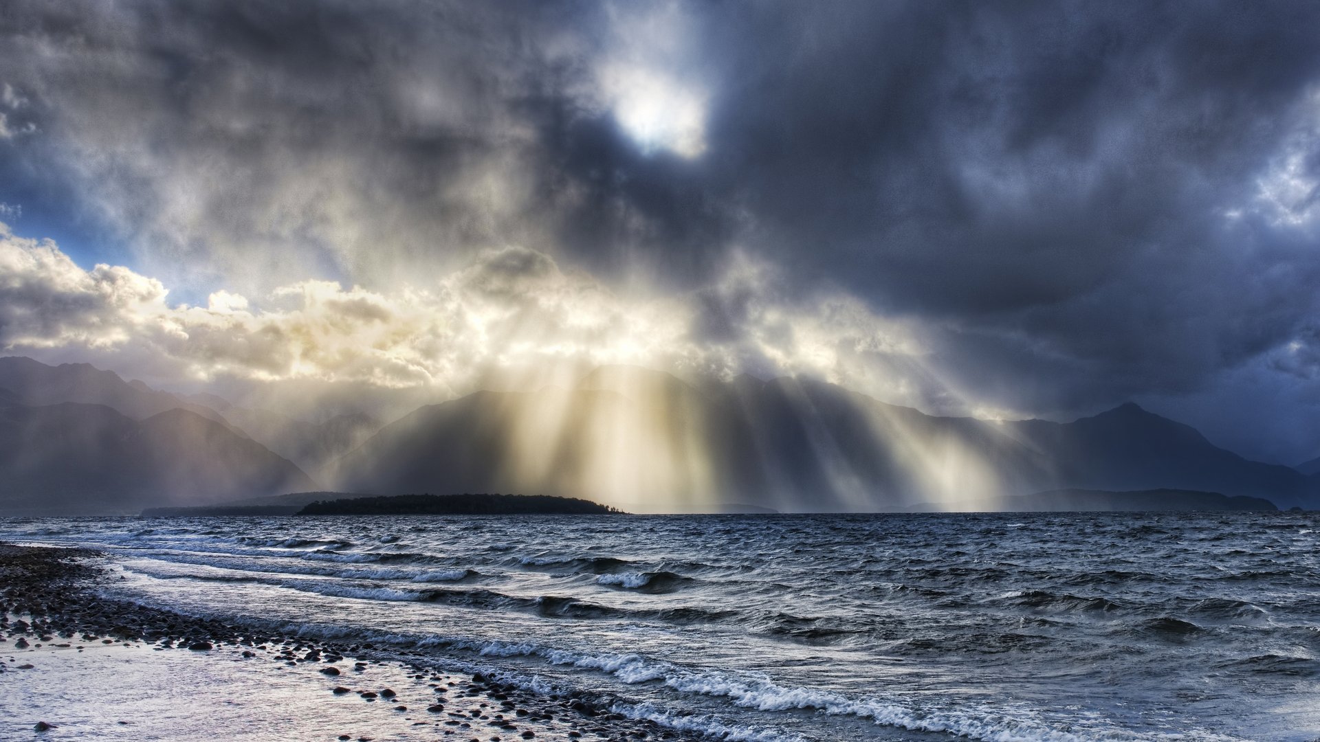 beach stones water waves clouds light ray