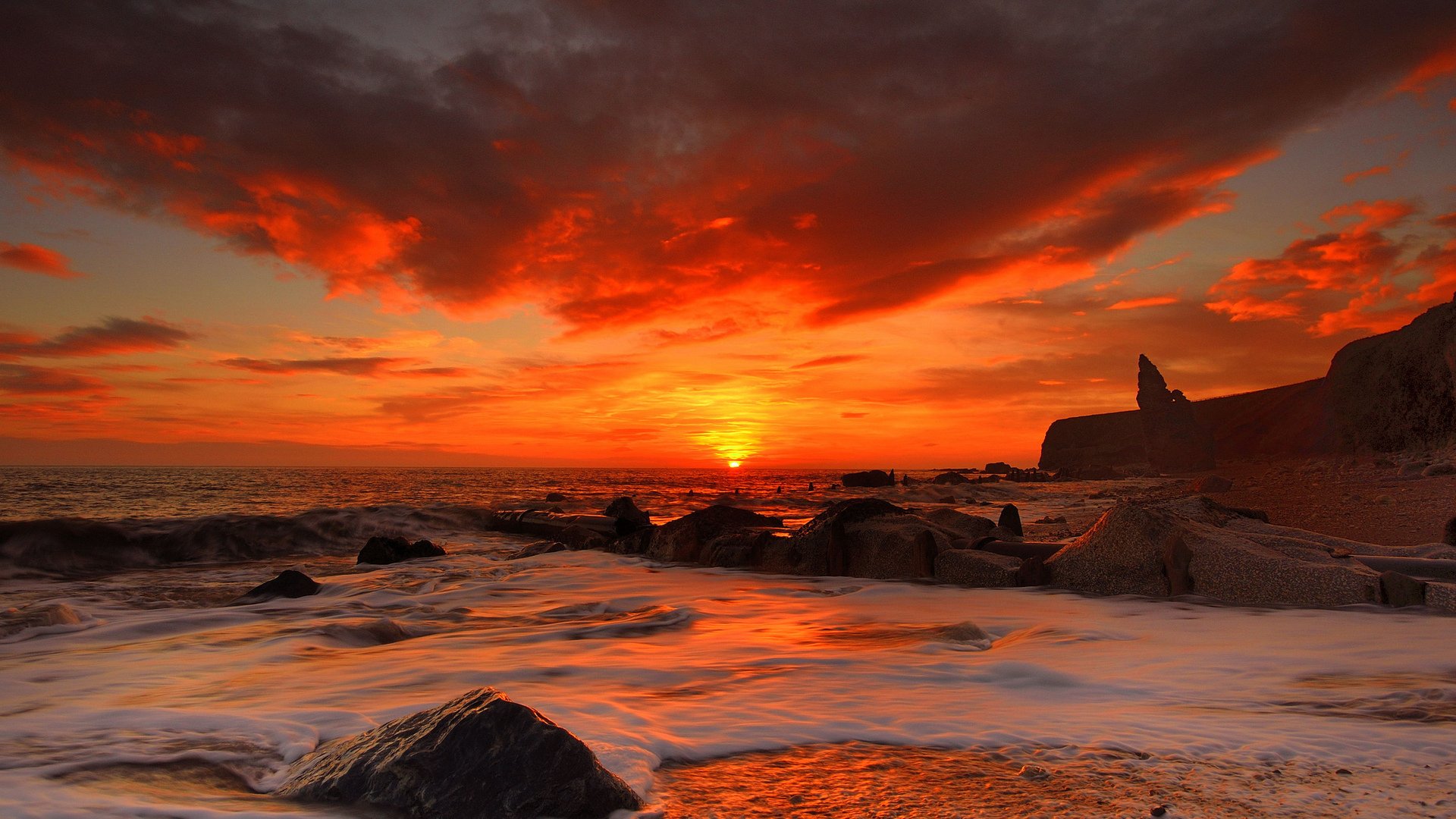 beach waves sky clouds stones sun