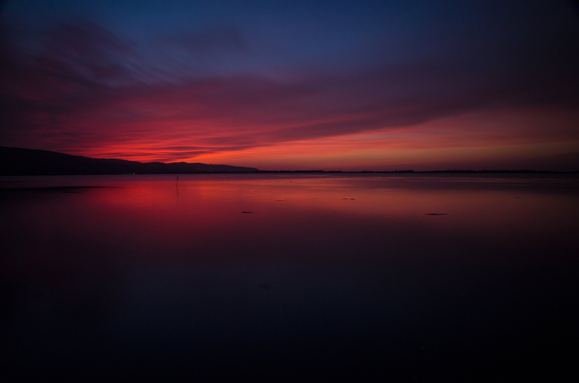 italien toskana meer lagune himmel glühen