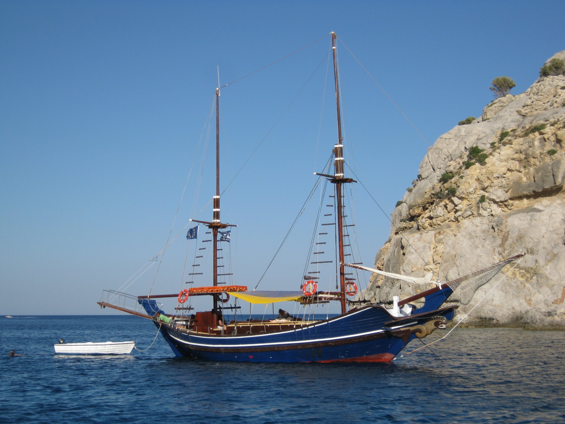 hips mediterranean sea rock sky blue boat sailboat