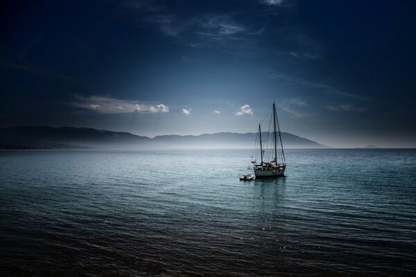 Floating sailboat on the gulf in Greece