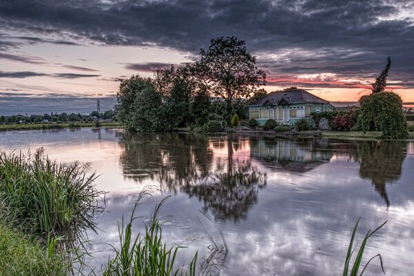 House by the water dawn in purple shades