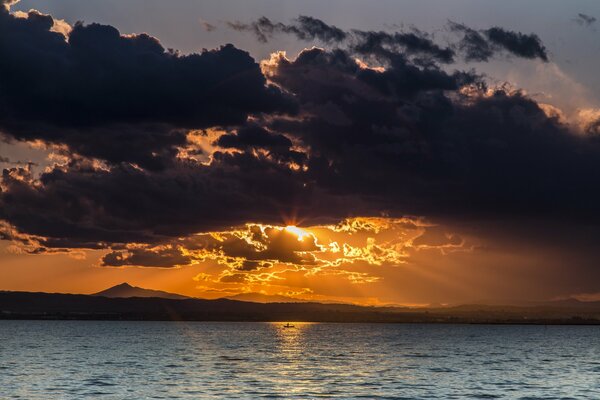 Lake in the sunset with clouds