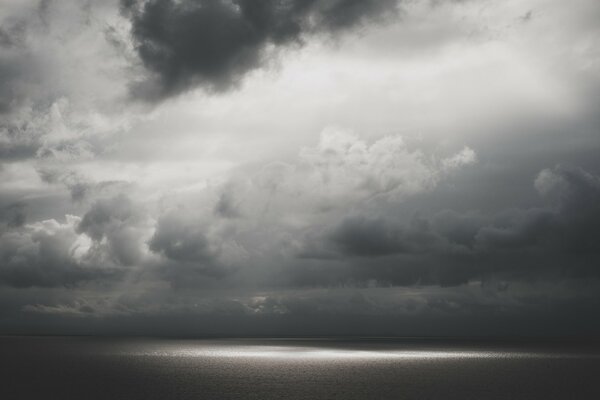 Water surface and sky with clouds