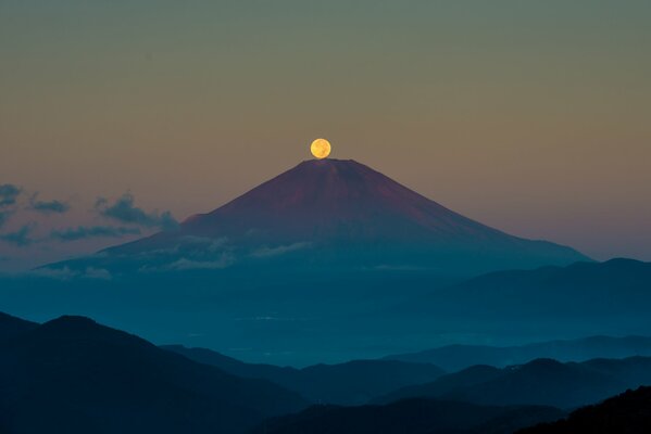 Mount Fujiyama in the moonlit sky of September