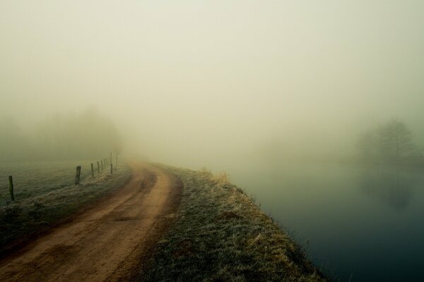 The road past the river in the fog