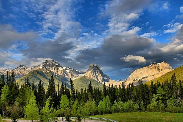 Rocky mountains are adjacent to a picturesque landscape. Canada