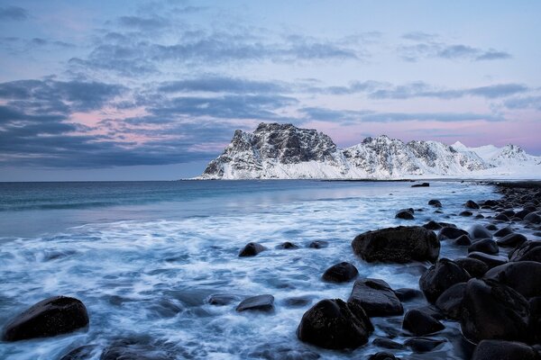 Snowy mountains sea surf