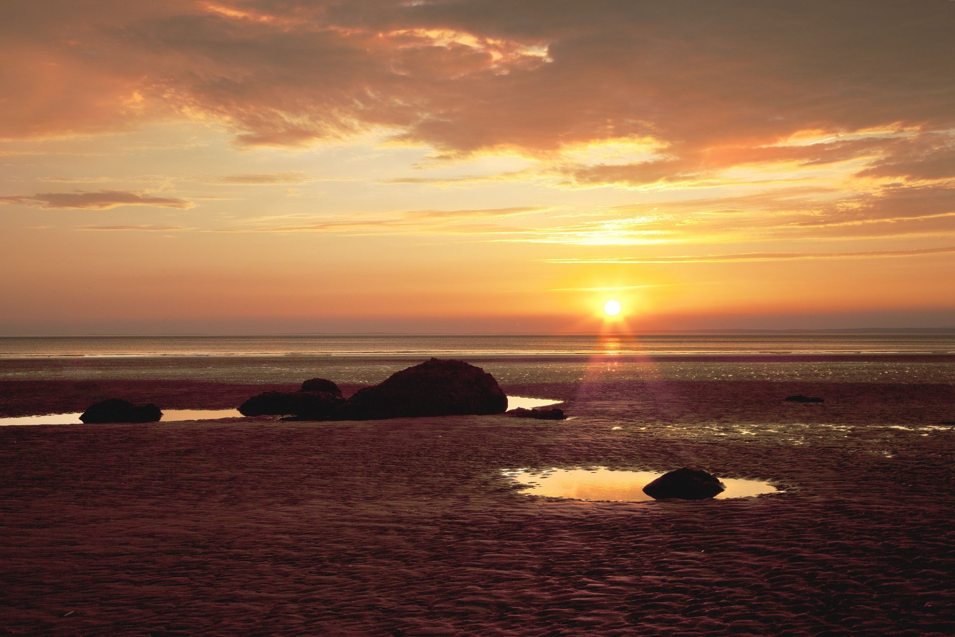 spiaggia mare rocce tramonto