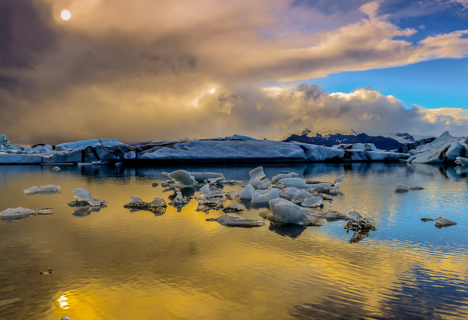 islandia śnieg lód chmury słońce