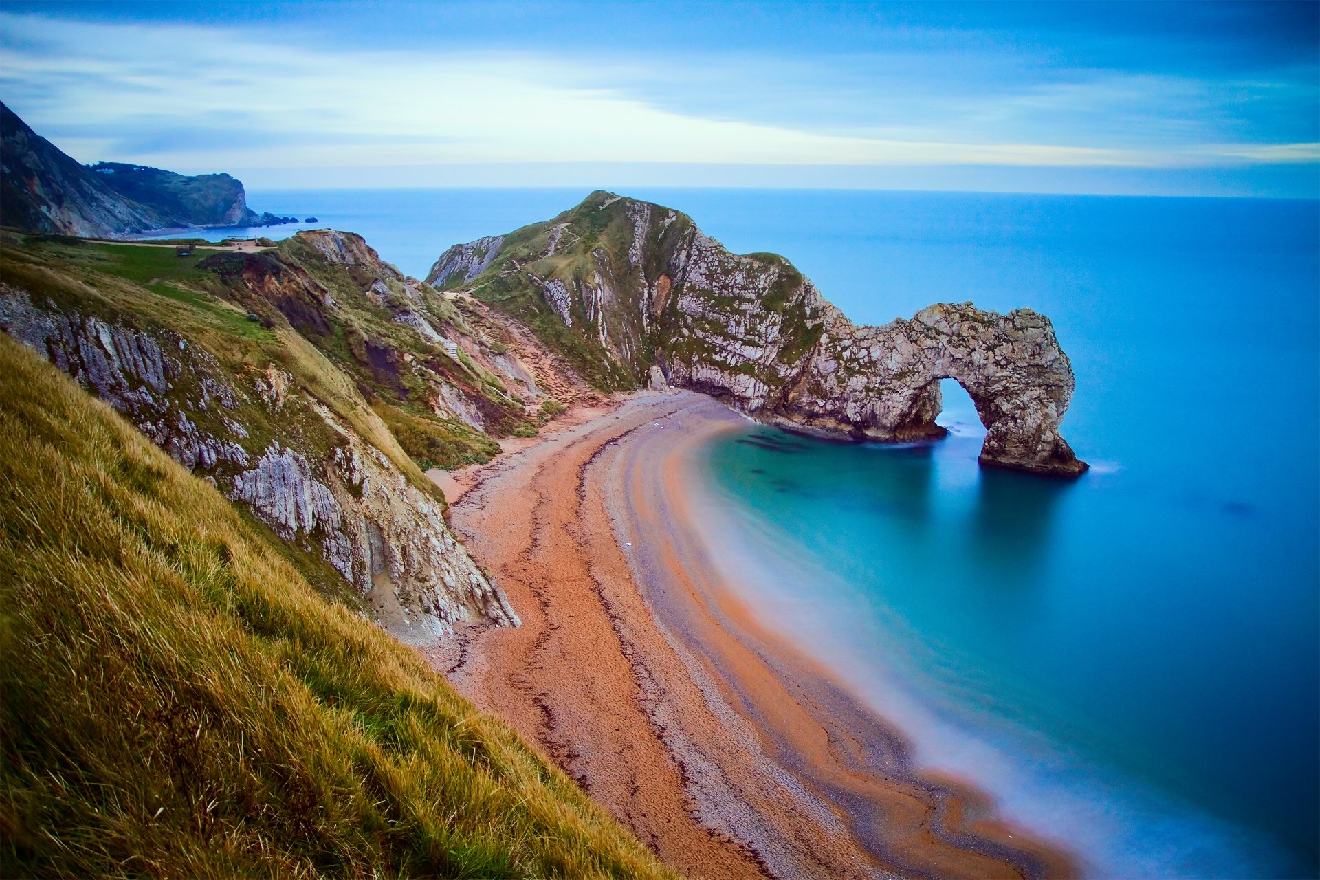 arche rochers plage ciel rivage
