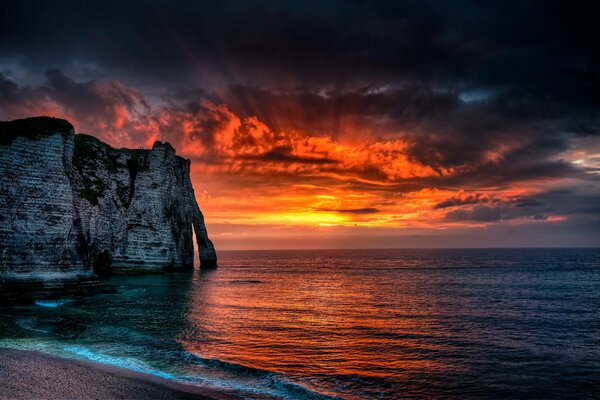 The rays of the sun break through the clouds seascape