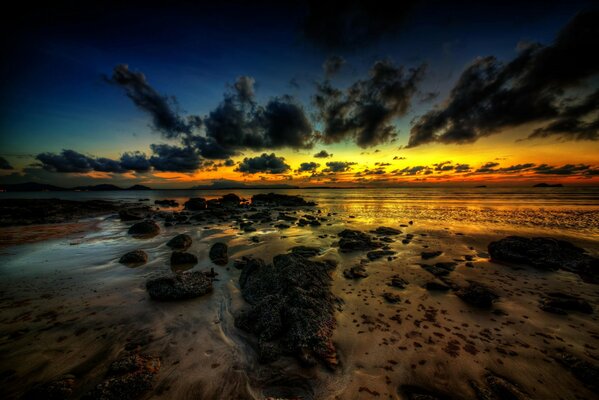 Incredible dark clouds on the background of sunset