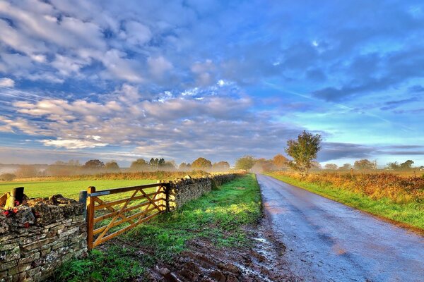 The morning sun illuminates the rural road