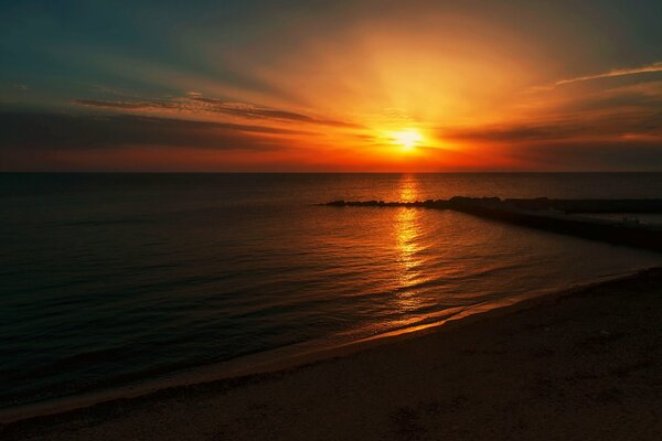 Sunset sun on the beach by the sea
