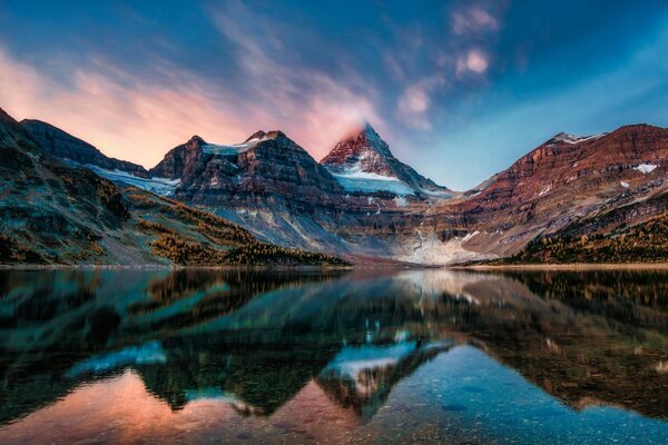 The reflection of the mountains in the mirror surface of the lake