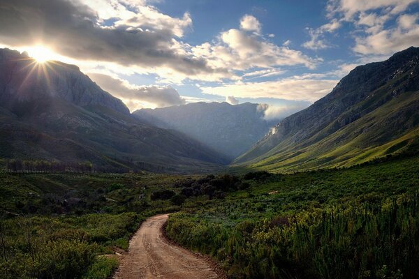 Mountainous terrain, sunset trail