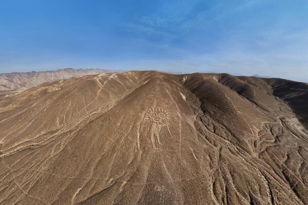 A desert plateau with bizarre lines and patterns