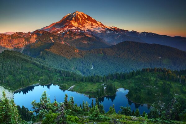 Clear blue lake, mountain in the distance