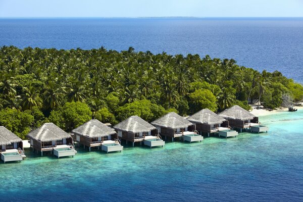 A hotel with exotic houses in the middle of the ocean